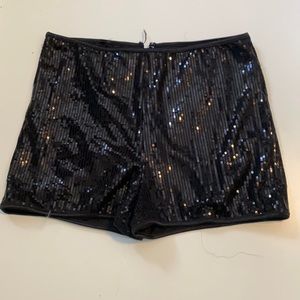 Black sequin booty shorts with gold zipper